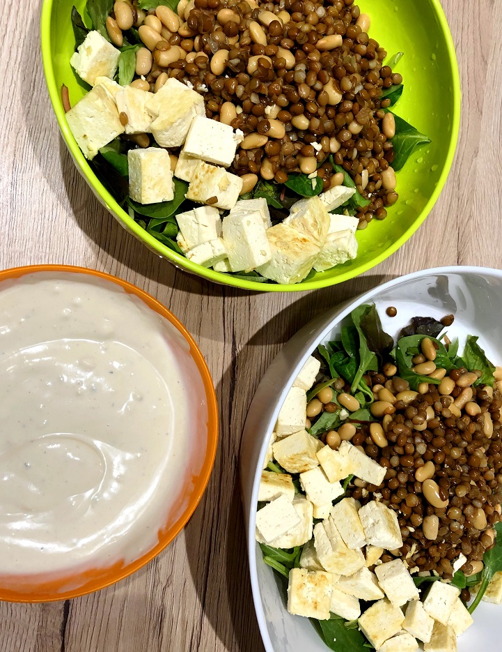 Salad bowl with lentils, soy, tofu and hummus dressing